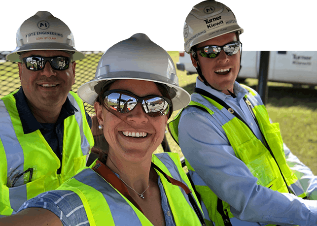 Motz Engineering workers wearing hard hats, sunglasses, and safety vests