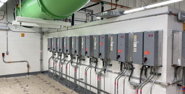 Orlando International Airport Terminal Commissioning with row of gray electrical control panels