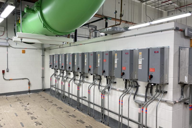 Orlando International Airport Terminal Commissioning with row of gray electrical control panels